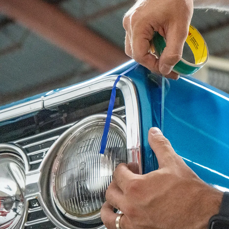 wrap technician applying pinstriping