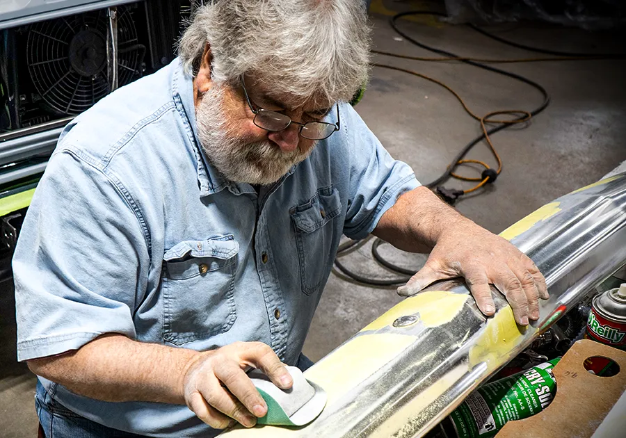 craftsman working on a vehicle restoration